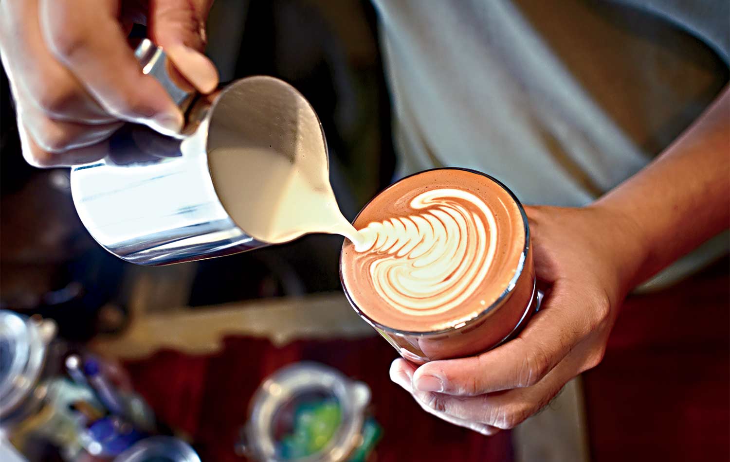 Barista making latte art