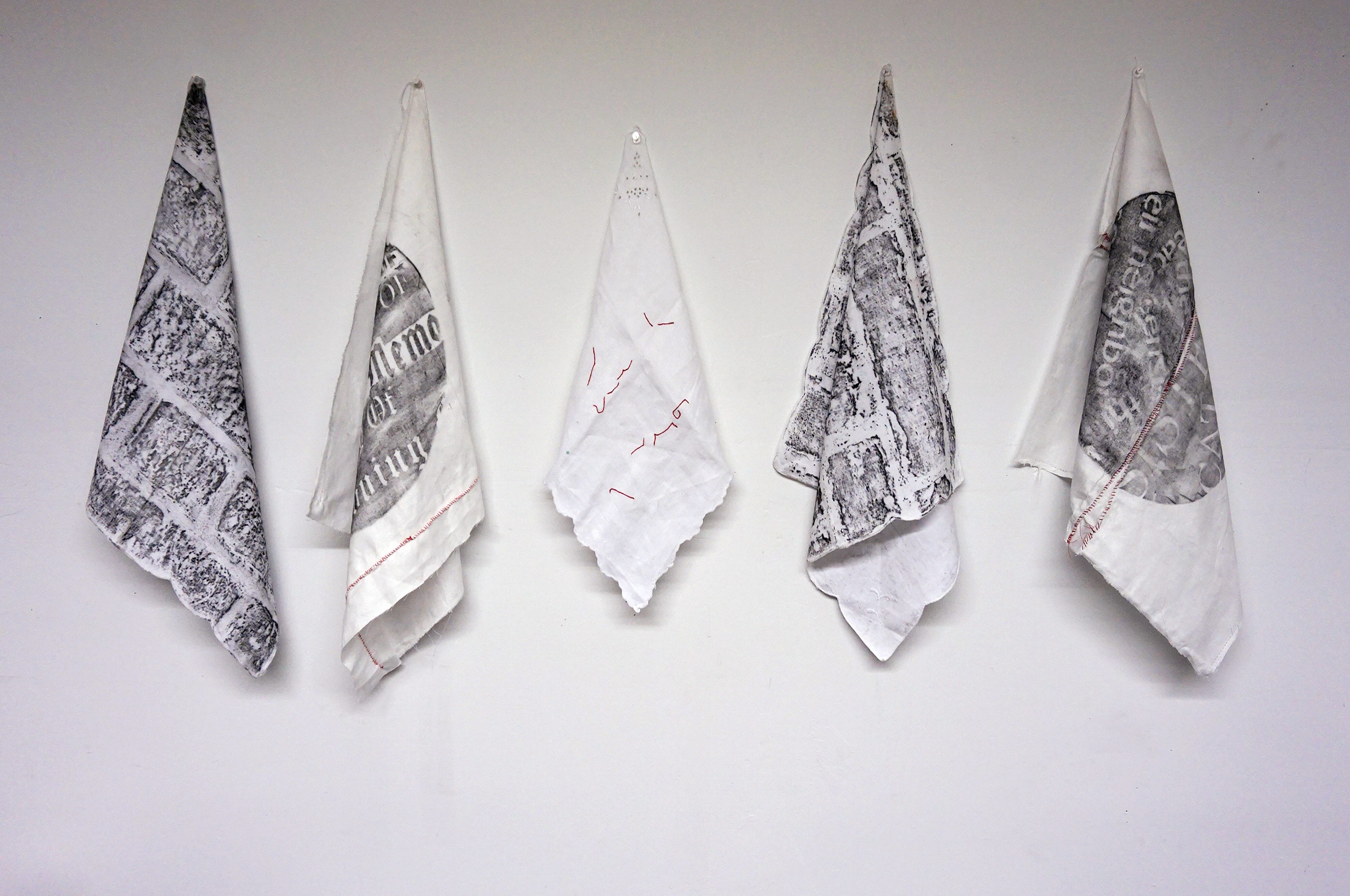 Sketches and rubbings on white linen